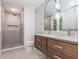 Modern bathroom with double vanity, a walk-in shower, and stylish finishes at 3009 Hillmer Dr, Raleigh, NC 27609