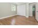 Inviting bedroom with hardwood floors, closet space, and natural light at 3009 Hillmer Dr, Raleigh, NC 27609