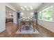 Charming dining area with an open layout, featuring custom cabinets and natural light at 3009 Hillmer Dr, Raleigh, NC 27609
