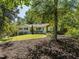 Lush front exterior of a charming home with a beautifully maintained yard, mature trees, and inviting curb appeal at 3009 Hillmer Dr, Raleigh, NC 27609
