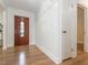 The entry foyer features a detailed front door, wainscoting, and beautiful hardwood flooring throughout at 3009 Hillmer Dr, Raleigh, NC 27609