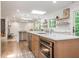 Open floor plan featuring an eat-in kitchen with a breakfast bar and stainless steel appliances at 3009 Hillmer Dr, Raleigh, NC 27609
