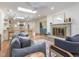 Open floor plan featuring living room, kitchen, fireplace, and hardwood floors throughout at 3009 Hillmer Dr, Raleigh, NC 27609