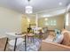 Open living space with a bedroom in the background, featuring stylish furniture and bright lighting at 3009 Hillmer Dr, Raleigh, NC 27609