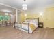 Spacious primary bedroom with a sitting area, elegant lighting, and ample closet space at 3009 Hillmer Dr, Raleigh, NC 27609