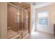 Well-appointed bathroom with tiled shower and updated fixtures at 311 Alamosa Pl, Cary, NC 27519