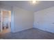 Carpeted bedroom featuring two doors—one to the hallway, the other to an en-suite bathroom, offering privacy and convenience at 311 Alamosa Pl, Cary, NC 27519
