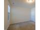 Bare bedroom with carpet and a window; the space is ready for personalization and furnishing at 311 Alamosa Pl, Cary, NC 27519