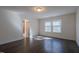 Bright bedroom featuring hardwood floors and abundant natural light at 311 Alamosa Pl, Cary, NC 27519