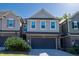 Charming two-story home with a two-car garage and attractive brick and siding exterior at 311 Alamosa Pl, Cary, NC 27519