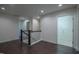 Hallway with hardwood flooring, neutral paint, and natural lighting at 311 Alamosa Pl, Cary, NC 27519