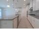 Modern kitchen features white cabinets, granite countertops, and stainless steel appliances at 311 Alamosa Pl, Cary, NC 27519
