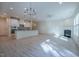Open-concept living space connecting kitchen, dining, and living areas with lots of natural light at 311 Alamosa Pl, Cary, NC 27519