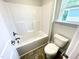 Clean bathroom with shower-tub combo, toilet, and tile flooring at 327 Bishop Ln, Sanford, NC 27330