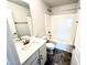 Bathroom featuring a shower over tub, white vanity and black and bronze hardware at 332 Bishop Ln, Sanford, NC 27330
