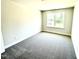 Bedroom with neutral carpet, paint color and a large window at 332 Bishop Ln, Sanford, NC 27330