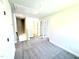 Spacious, carpeted bonus room with neutral walls and attic access at 332 Bishop Ln, Sanford, NC 27330