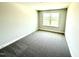 Bedroom featuring neutral carpet, and a bright window at 332 Bishop Ln, Sanford, NC 27330