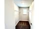 Walk-in closet featuring carpet, wire shelving, and a window for natural light at 332 Bishop Ln, Sanford, NC 27330