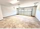 Spacious two car garage with a high ceiling and an automatic garage door opener at 332 Bishop Ln, Sanford, NC 27330