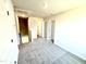 Hallway with neutral carpet shows access to other rooms in the house at 332 Bishop Ln, Sanford, NC 27330