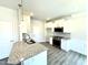 Updated kitchen with granite countertops, modern appliances, and ample cabinet space at 332 Bishop Ln, Sanford, NC 27330