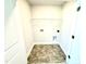 Laundry room with washer and dryer hookups and tile flooring at 332 Bishop Ln, Sanford, NC 27330