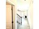 Hallway view of the living room with a fireplace and staircase at 332 Bishop Ln, Sanford, NC 27330