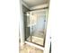 Shower with gray subway tile and glass doors at 332 Bishop Ln, Sanford, NC 27330