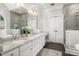 Elegant bathroom featuring double vanities, granite countertops, and stylish tile at 3440 Black Bear Cv, Burlington, NC 27215
