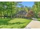 Traditional-style home with lush lawn and established landscaping at 3440 Black Bear Cv, Burlington, NC 27215