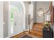 Grand foyer with staircase, hardwood floors, and chandelier lighting at 3440 Black Bear Cv, Burlington, NC 27215