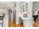 Kitchen area features stainless steel refrigerator and a built-in desk with overhead cabinets at 3440 Black Bear Cv, Burlington, NC 27215