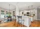 Eat-in kitchen features an island with seating, a breakfast nook, and white cabinetry at 3440 Black Bear Cv, Burlington, NC 27215