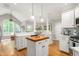 Bright kitchen featuring a central island, stainless appliances, and an open layout at 3440 Black Bear Cv, Burlington, NC 27215