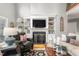 Open-concept living room boasts a fireplace, built-in shelving, and comfortable seating at 3440 Black Bear Cv, Burlington, NC 27215