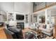 Spacious living room with fireplace, built-ins, hardwood floors, and abundant natural light at 3440 Black Bear Cv, Burlington, NC 27215