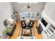 Bright, spacious living room featuring a fireplace, hardwood floors, and large windows with an outdoor view at 3440 Black Bear Cv, Burlington, NC 27215