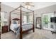 Spacious main bedroom featuring a canopy bed and natural light at 3440 Black Bear Cv, Burlington, NC 27215