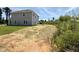View of home's backyard showing land and proximity to undeveloped natural area at 356 Bishop Ln, Sanford, NC 27330
