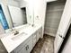 This bathroom features double sinks and linen closet at 356 Bishop Ln, Sanford, NC 27330