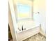 Modern bathtub with a window providing natural light and stylish fixtures at 356 Bishop Ln, Sanford, NC 27330