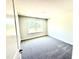 This bedroom features neutral decor and carpet, and a lovely view to the outdoors at 356 Bishop Ln, Sanford, NC 27330