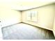 Bright bedroom features a large window and neutral carpet at 356 Bishop Ln, Sanford, NC 27330