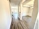 Entryway featuring wood-look flooring, views to other rooms, and access to the staircase at 356 Bishop Ln, Sanford, NC 27330