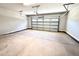 Clean two car garage with white door and plenty of space for parking and storage at 356 Bishop Ln, Sanford, NC 27330