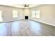 Living room features fireplace, luxury vinyl plank flooring, and plenty of natural light at 356 Bishop Ln, Sanford, NC 27330