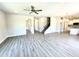 Open living space with luxury vinyl plank flooring and open floor plan to kitchen at 356 Bishop Ln, Sanford, NC 27330