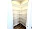 Walk-in pantry featuring floor-to-ceiling metal shelving for maximum storage and organization space at 356 Bishop Ln, Sanford, NC 27330