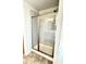 Modern tile shower with glass doors and a shower head at 356 Bishop Ln, Sanford, NC 27330